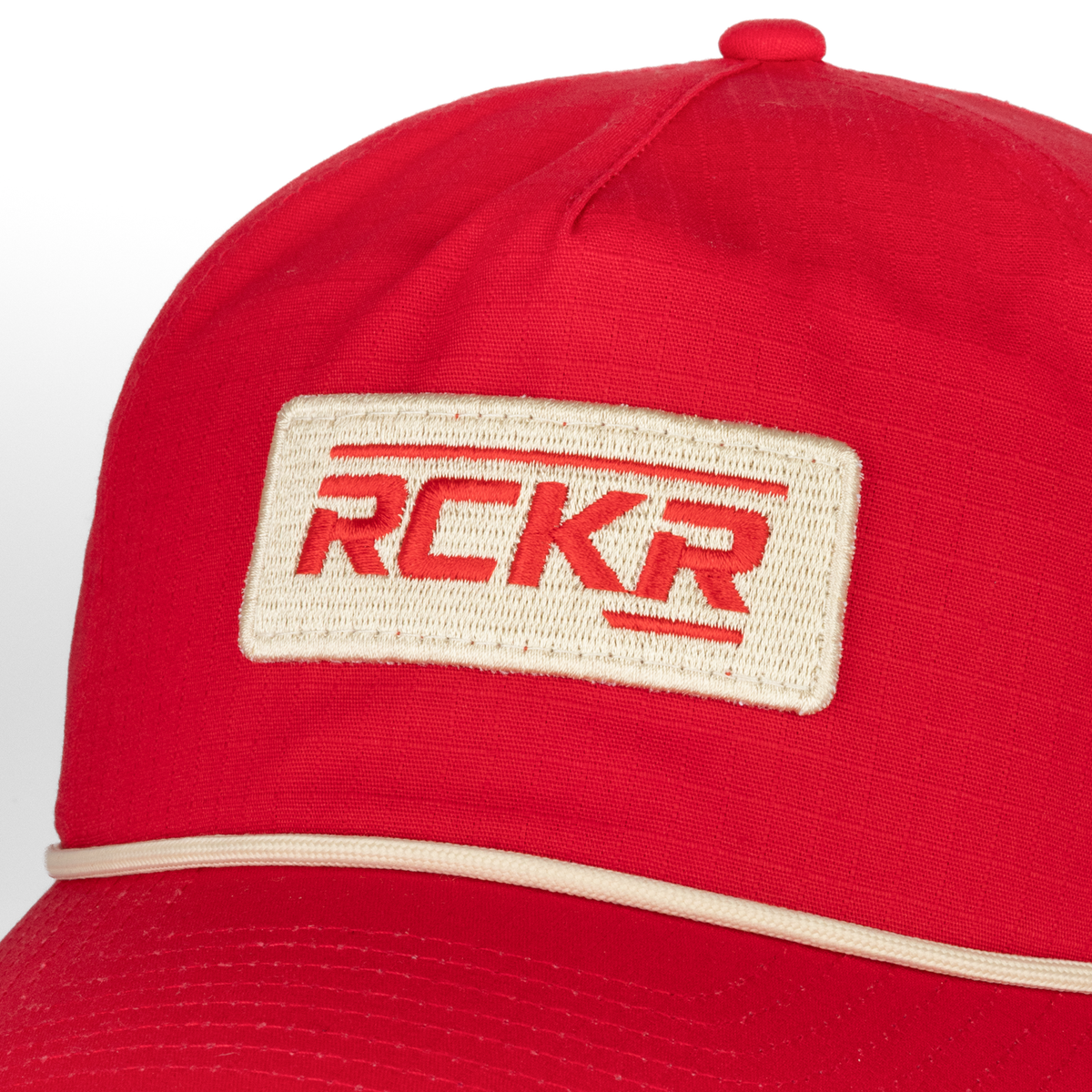 Closeup of RCKR patch on front of red hat