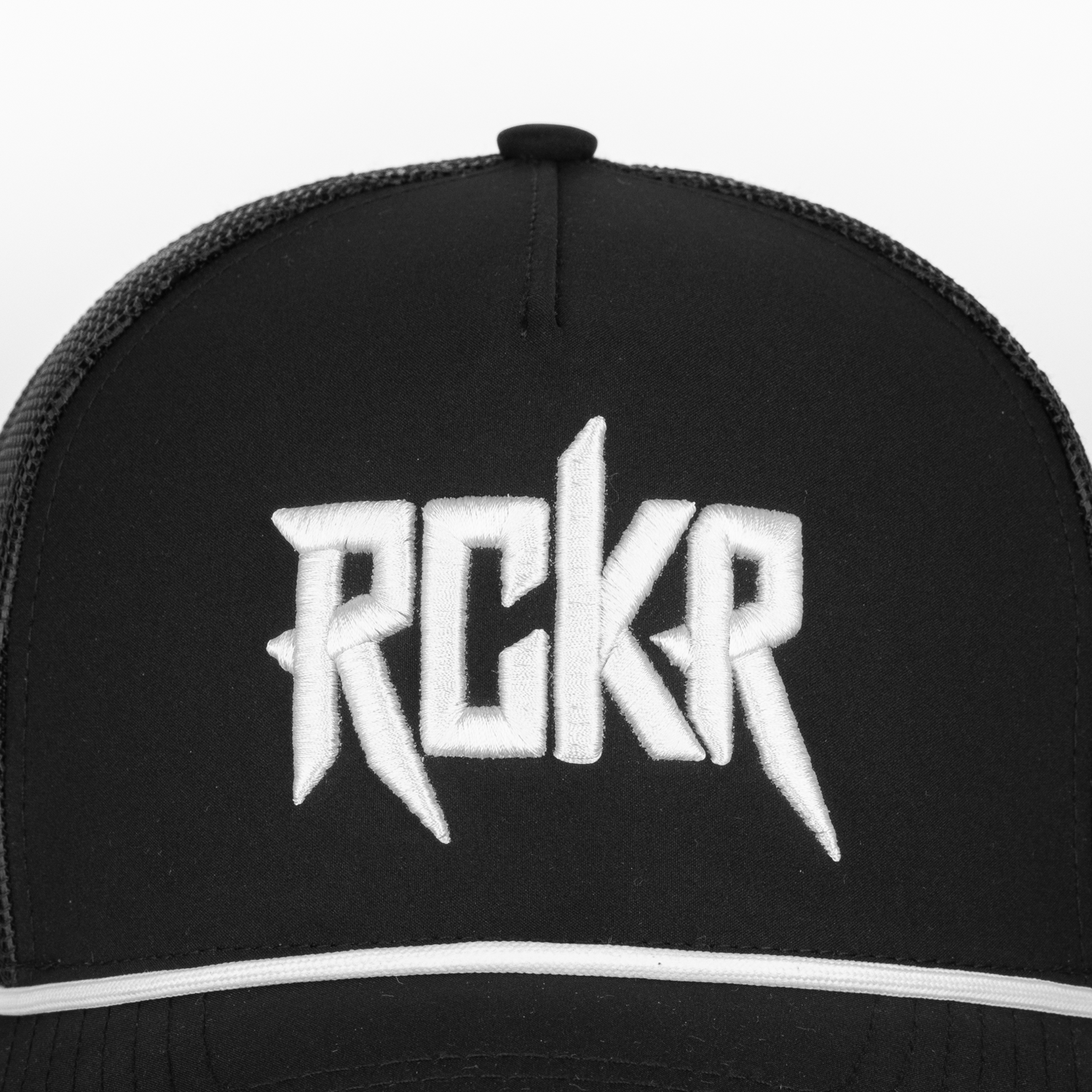 closeup of white "RCKR" logo on front of black hat